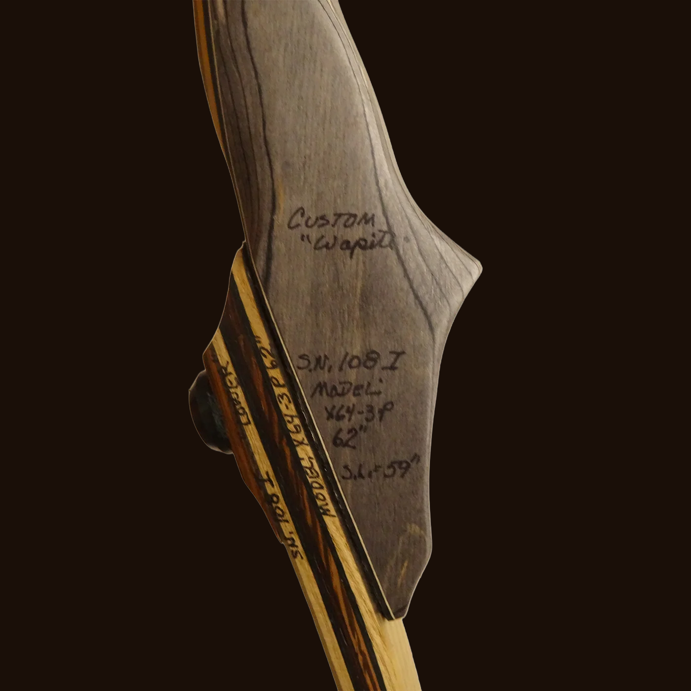 Wapiti longbow riser with hand-written specifications